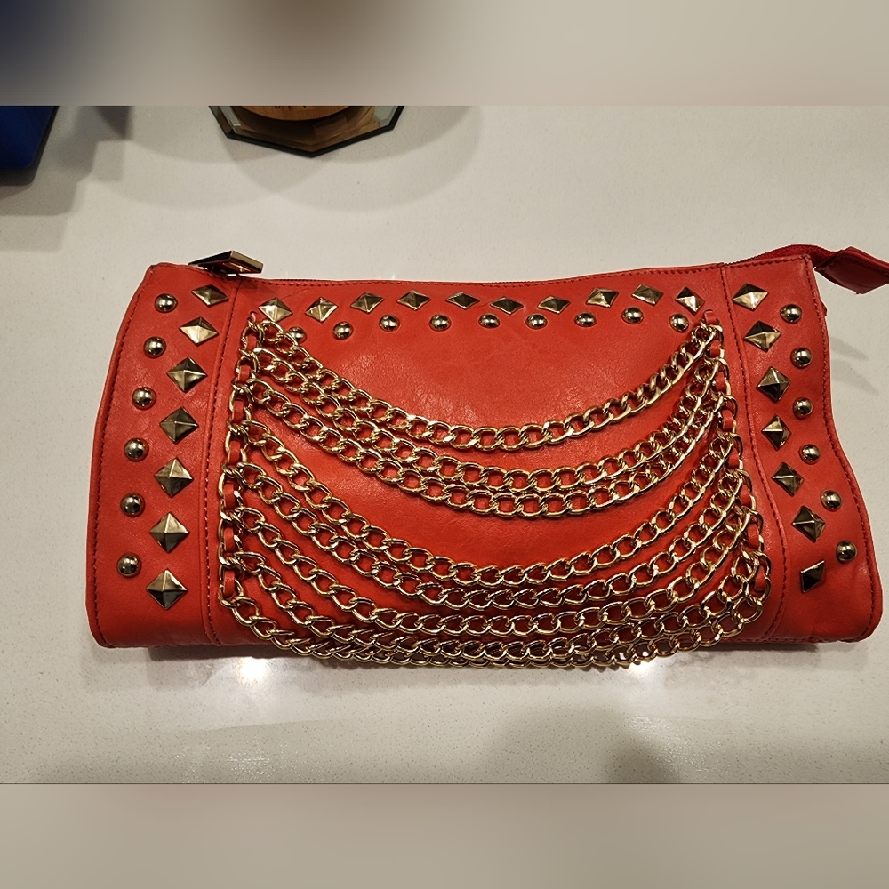 New without tags dark coral clutch purse.